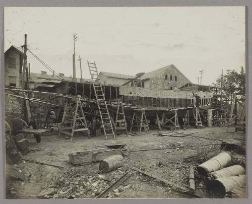 Tug under construction at the Pontbriand Ltée, Sorel, QC [Early stage in construction of boat hull frame]