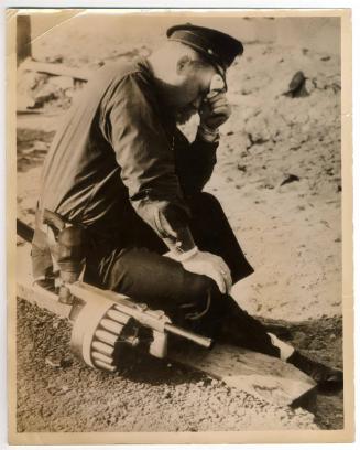 Tired Cop. A Policemen on Duty at the Goddyear Tyre [sic] and Rubber Company's Works at Akron Ohio, where Recent Rioting Injured 80 People…