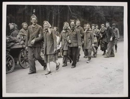 Liberated French women and men on the road home from a concentration camp west of Berlin
