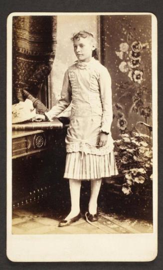 Unknown sitter [portrait of a girl standing with a book]