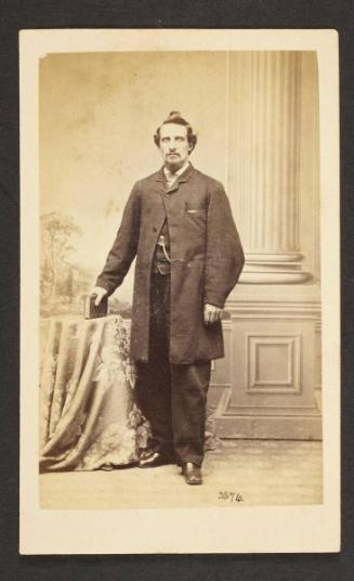 Unknown sitter [portrait of a standing man with a book]