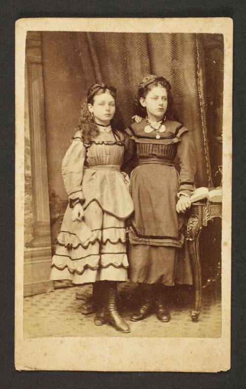 Unknown sitters [portrait of two girls standing]