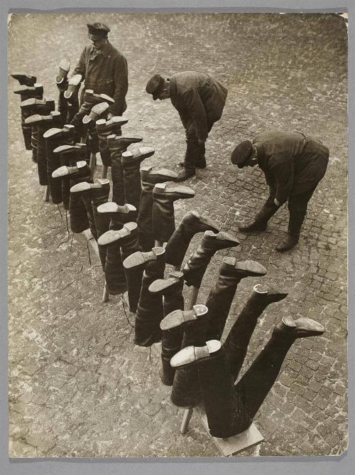 The sewer workers, who have to wade through deep water, put on watertight waders.