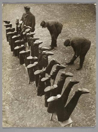 The sewer workers, who have to wade through deep water, put on watertight waders.