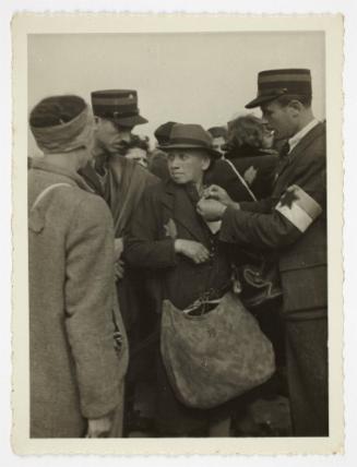 Ghetto resident being tagged by ghetto police for deportation