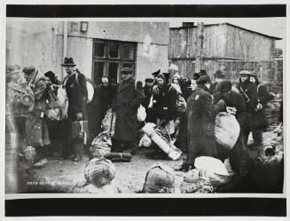 Deportation of residents with sacks and bedrolls