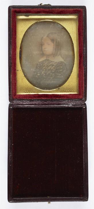 [Portrait of a young girl with curls]