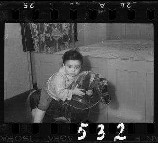 Portrait of a young child on a rocking horse