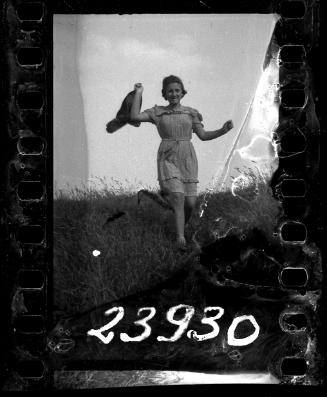 Young girl with a scarf running