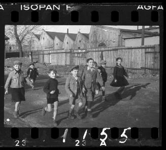 Children playing as ghetto policeman