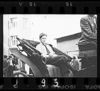 Man sitting in a carriage in the ghetto