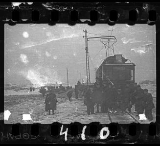 Members of the Transport Department and Jewissh police officers posing in front of a tram delivering cabbage to the ghetto