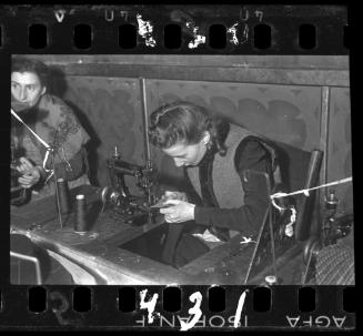 A woman sewing in a workshop ("ressort") in the ghetto