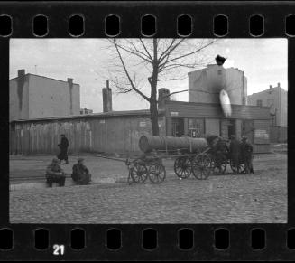 Fecal workers hauling a sewage collecting tank mounted on a wagon through the ghetto
