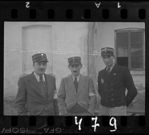 Three Jewish policeman standing in the ghetto
