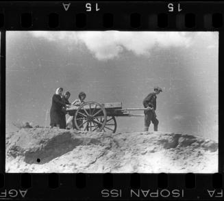 A young boy pulling a hearse to the burial ground
