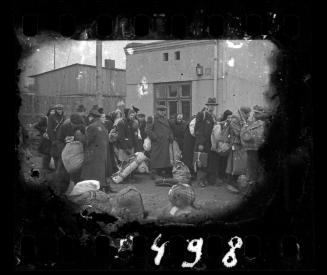 Deportation of residents with sacks and bedrolls