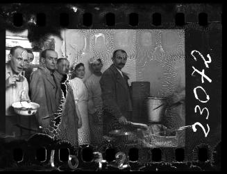 Managers and workers in the hospital kitchen