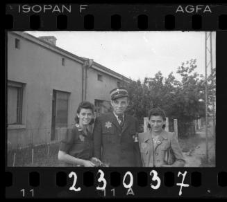 A Jewish policeman and two women in the ghetto