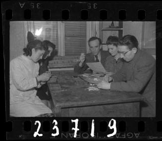 Administrator and staff reviewing documents on a table