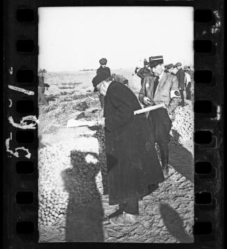 Shadow of Henryk Ross photographing [on official assignment] in the Lodz Ghetto