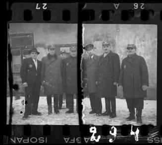 Workers of the Transport Department standing outside of a building in the winter
