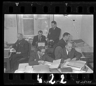 Members of the ghetto administration working in an office