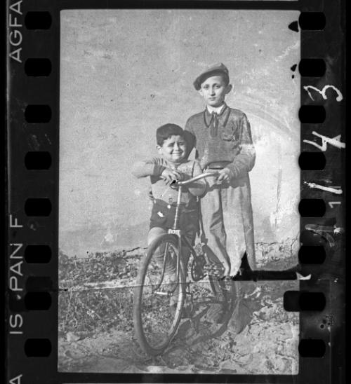 Two boys with a bike