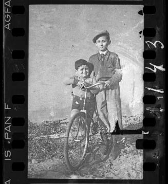 Two boys with a bike