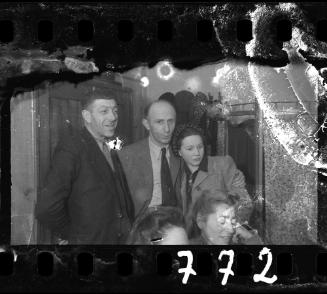 Group of five residents gathered in a house in the ghetto