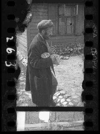 A starving man walking in the ghetto