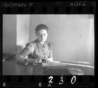 Woman writing at a desk