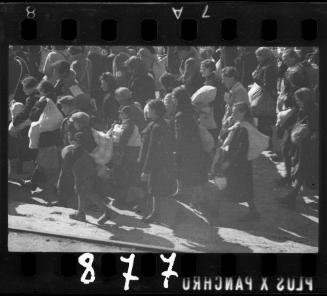 Residents being deported from the ghetto, walking with their belongings