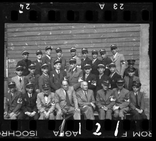 Group portrait of Jewish policeman and a member of the Transport Department outside an unidentified building