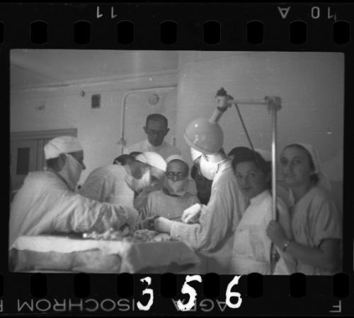 Doctors performing surgery on baby