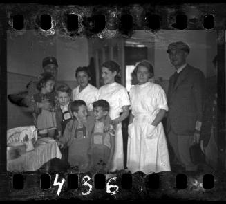 Ghetto policeman with nurses and children