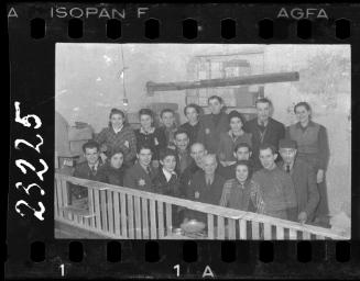 Group of administrators and workers in a room with unidentified parcels
