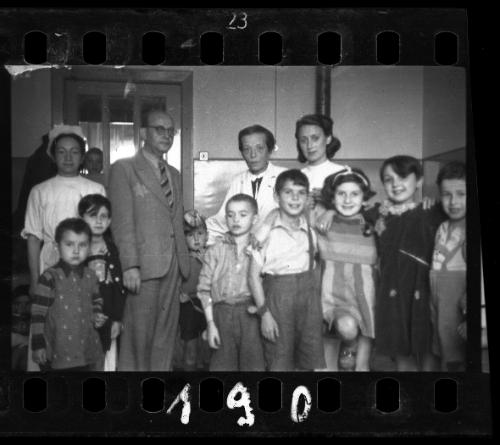 Children with nurses and administrator