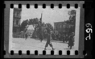 Lodz residents crossing the Zigerska Street bridge