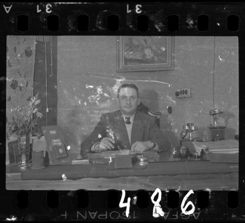 Administrator sitting at his desk