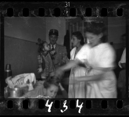 Ghetto policeman with children and nurses