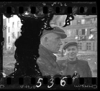 Two male residents in the street