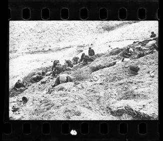 Residents searching for provisons buried in the ground