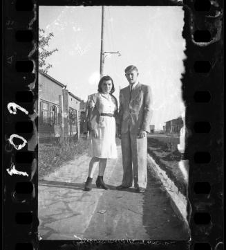 Young couple posing in the ghetto street