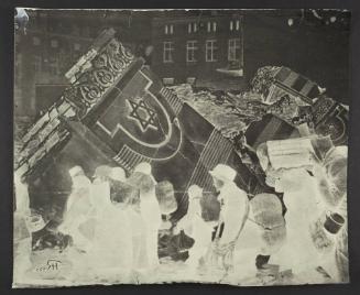 (In photomontage with synagogue in ruins) Boy in cap, with satchel and sack tied to back, walking with winter deportation crowd - side-profile
