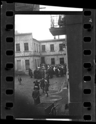 Crowd of residents gathered in a courtyard