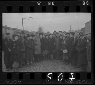 Large group of residents gathered in the street