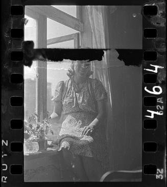 Portrait of Stefania Schoenberg sitting at the window