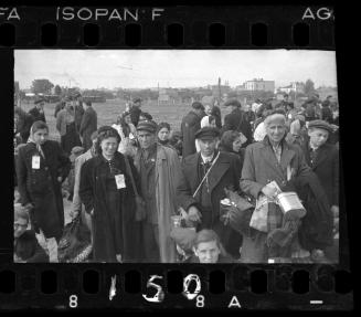Ghetto residents tagged for deportation, standing in the street