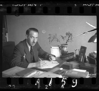 An administrator sitting at his desk